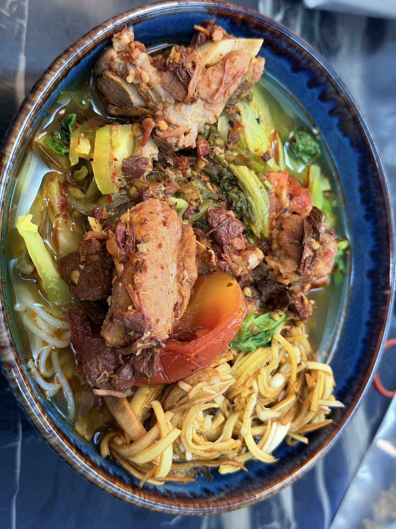 Roast chicken in a rich sauce, served over tagliatelle.
