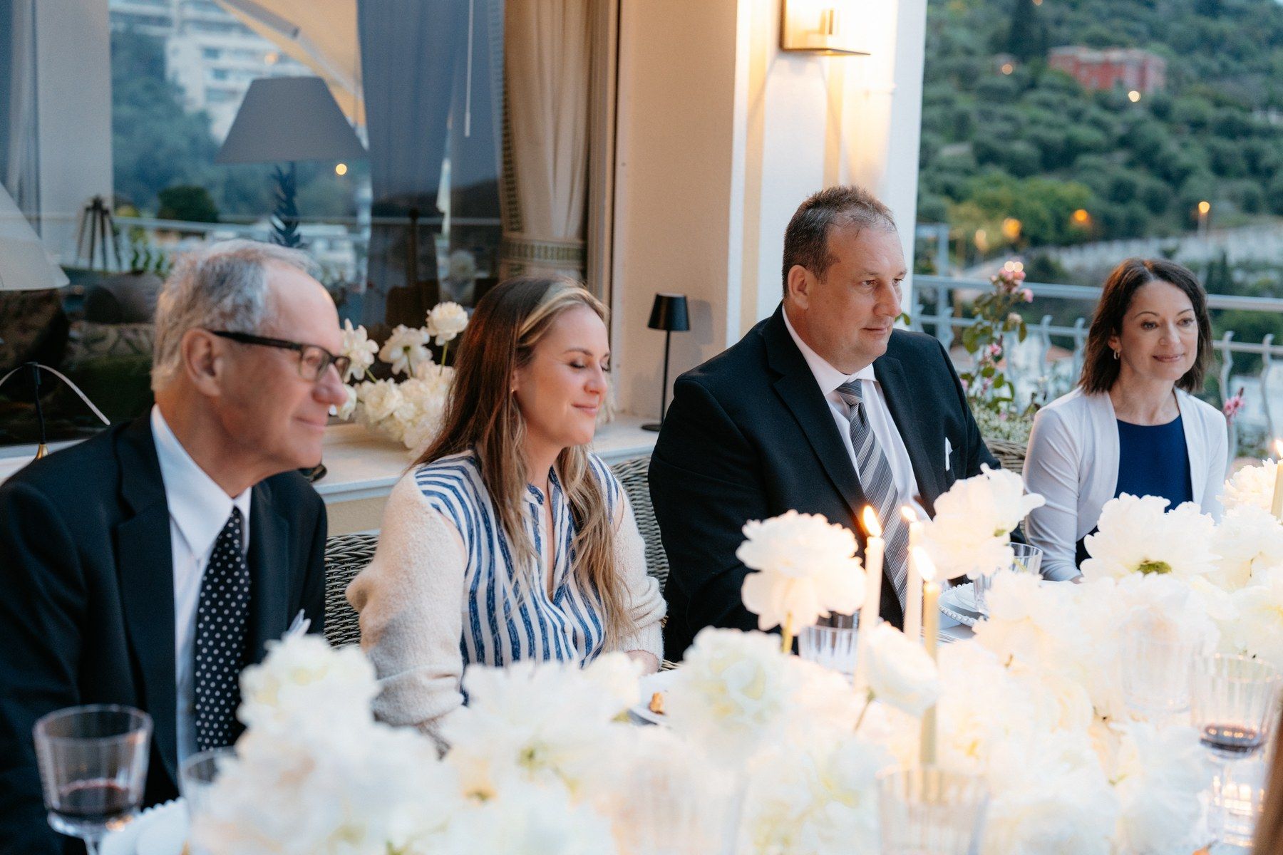Riviera dining setup, mid-service, with sea view.