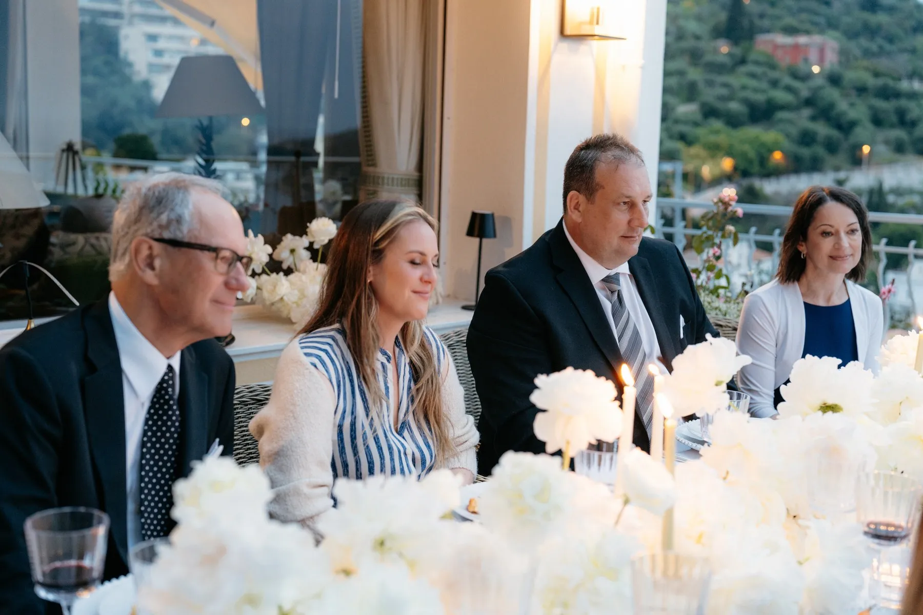 Riviera service in progress, plated courses laid out on a villa terrace.