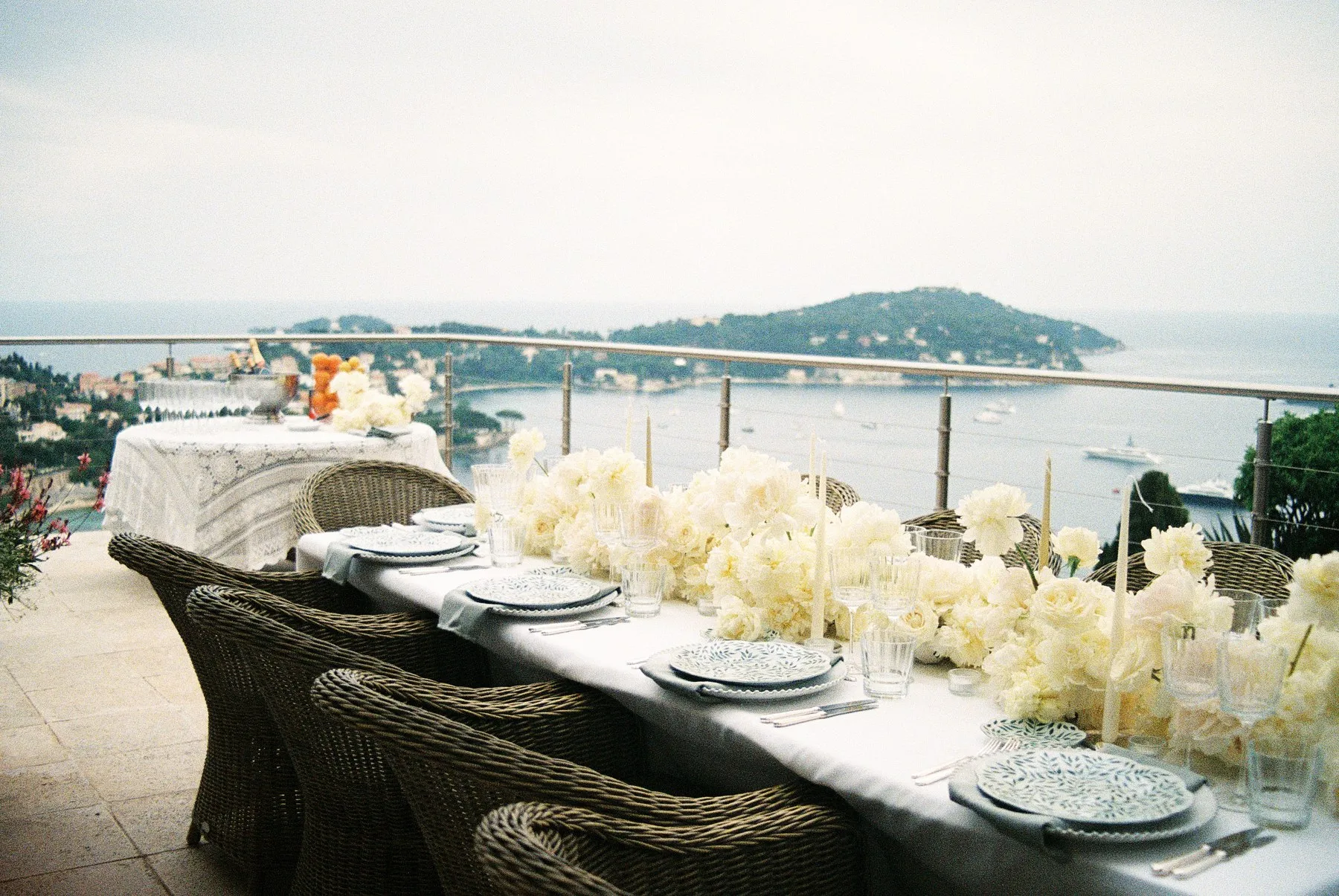 Overhead detail of a private dining table dressed with white florals.
